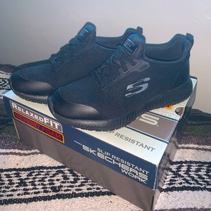 All black Sketcher work shoes.